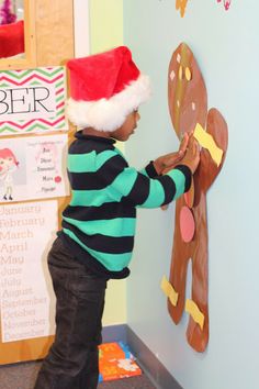 Reinforcing body part awareness and decorating a life size Gingerbreadman! Great Fine Motor activity with velcro!
